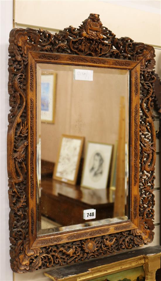 A 19th century Chinese carved mirror W.42cm